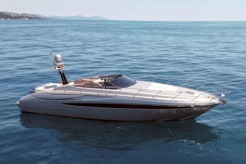 Infinity Yacht Photos Pics Luxury 2008 Riva 52 LE yacht cruising on calm blue waters.