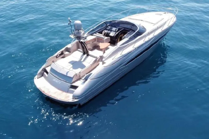 Infinity Yacht Photos Pics Luxury 2008 Riva 52 le yacht cruising on clear blue water.