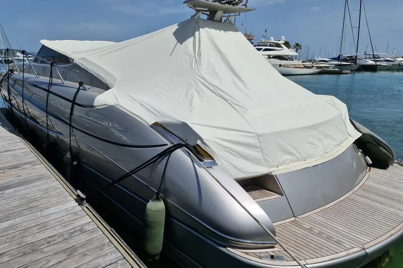 Infinity Yacht Photos Pics 2008 Riva 52 LE yacht docked with protective cover in a marina.