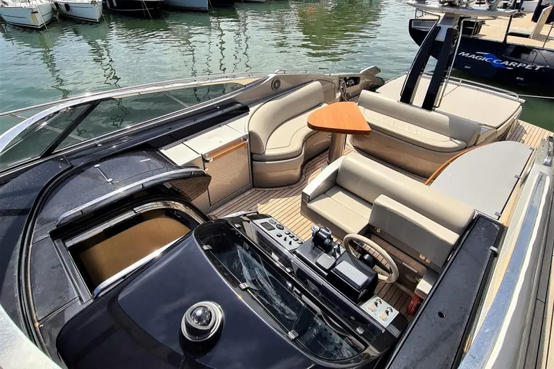 Infinity Yacht Photos Pics Luxurious 2008 Riva 52 LE yacht interior with elegant seating and modern controls.
