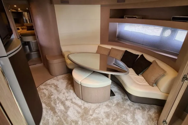 Infinity Yacht Photos Pics Luxurious interior of a 2008 Riva 52 LE yacht with elegant seating and modern design.