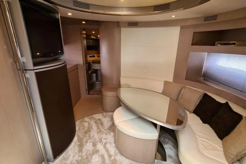 Infinity Yacht Photos Pics Luxurious interior of a 2008 Riva 52 LE yacht with modern seating and elegant decor.