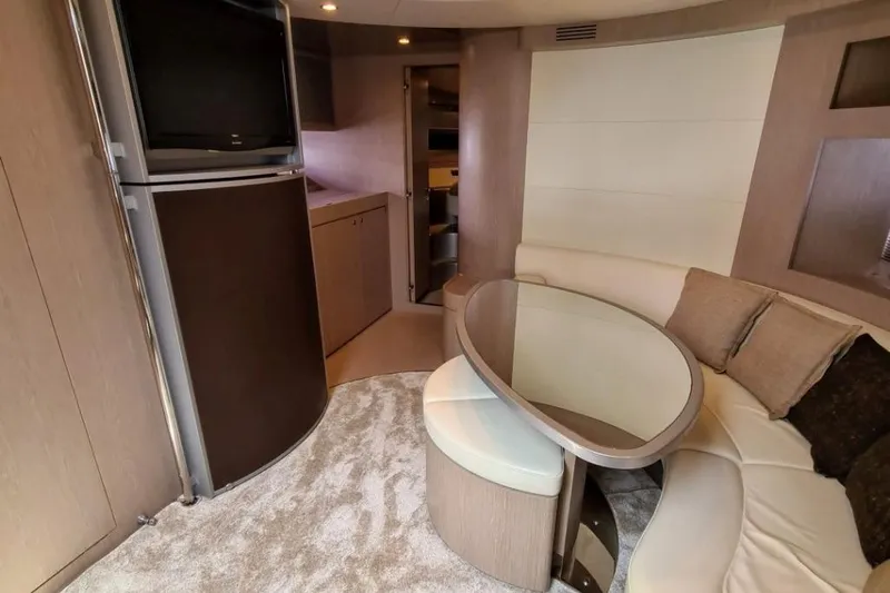 Infinity Yacht Photos Pics Luxurious interior of a 2008 Riva 52 LE yacht with modern seating and elegant decor.