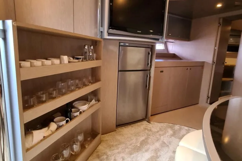 Infinity Yacht Photos Pics Luxurious interior of 2008 Riva 52 LE yacht with modern kitchen amenities.