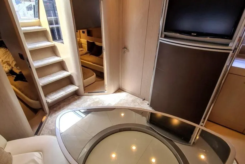 Infinity Yacht Photos Pics Luxurious interior of a 2008 Riva 52 LE yacht with modern furnishings and elegant design.