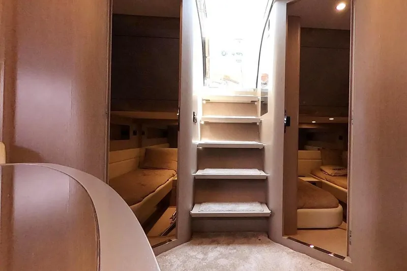Infinity Yacht Photos Pics Interior of 2008 Riva 52 LE yacht with stairs and cozy cabins.