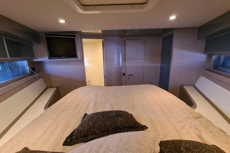 Infinity Yacht Photos Pics Luxurious cabin interior of 2008 Riva 52 LE yacht with cozy bedding and TV.