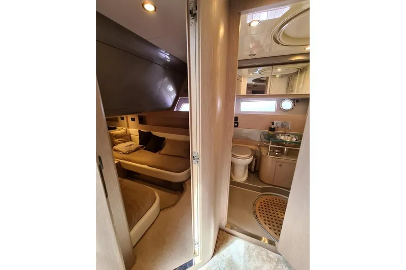 Infinity Yacht Photos Pics Luxurious interior of 2008 Riva 52 LE yacht featuring cozy bedroom and modern bathroom.