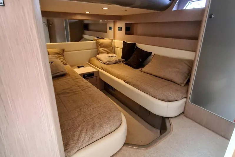 Infinity Yacht Photos Pics Luxurious interior cabin of a 2008 Riva 52 LE yacht with cozy twin beds.
