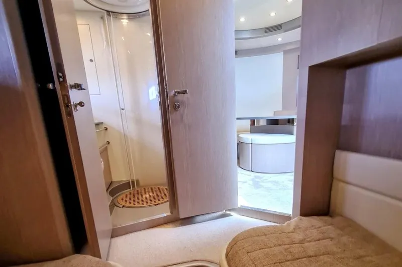 Infinity Yacht Photos Pics Interior of 2008 Riva 52 LE yacht, featuring a modern bathroom and seating area.
