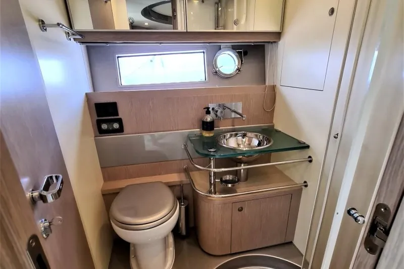 Infinity Yacht Photos Pics Luxurious bathroom in a 2008 Riva 52 LE yacht, featuring modern fixtures and elegant design.