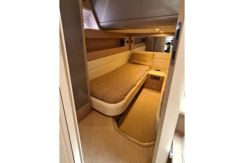 Infinity Yacht Photos Pics Interior cabin of 2008 Riva 52 LE yacht with cozy bed and modern design.