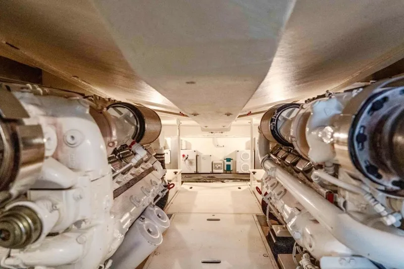 Infinity Yacht Photos Pics Engine room of a 2008 Riva 52 Rivale yacht, showcasing dual engines and mechanical components.