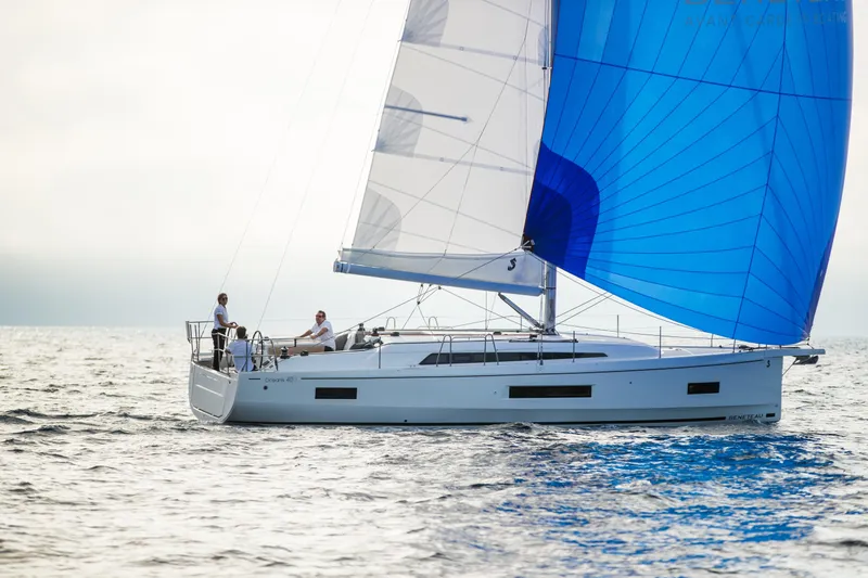 Yacht Photos Pics 2021 Beneteau Oceanis 40.1 sailing with blue spinnaker on open water.