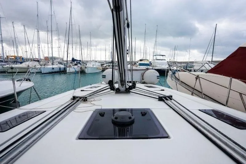  Yacht Photos Pics 2021 Beneteau Oceanis 40.1 sailboat deck view in a marina with cloudy skies.