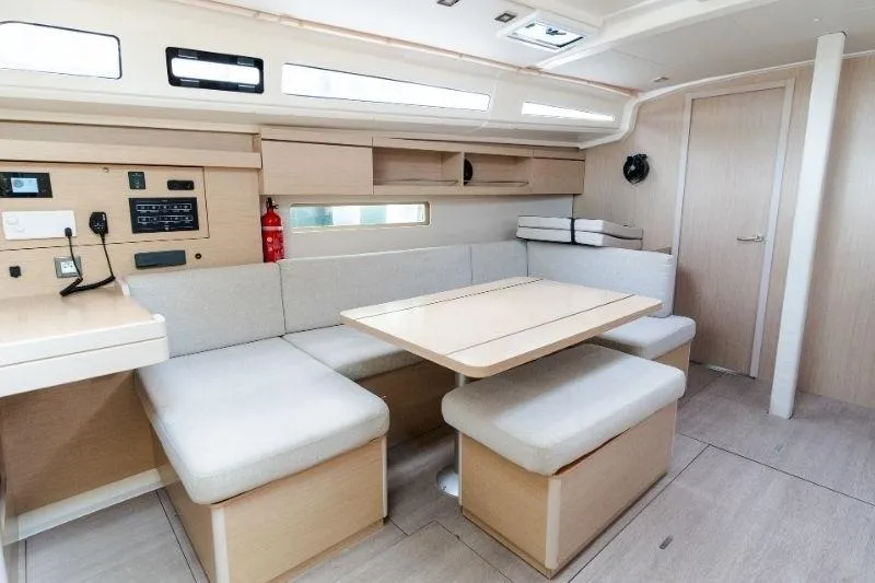  Yacht Photos Pics Modern interior of 2021 Beneteau Oceanis 40.1 yacht with light wood finishes.