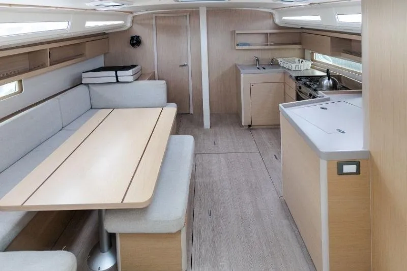  Yacht Photos Pics Interior of 2021 Beneteau Oceanis 40.1 yacht, featuring modern kitchen and dining area.