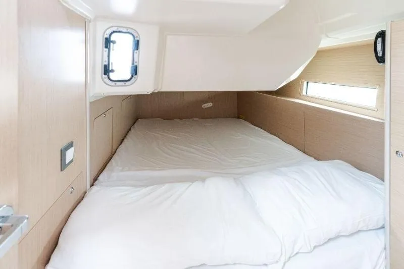  Yacht Photos Pics Cozy cabin interior of 2021 Beneteau Oceanis 40.1 yacht with comfortable bedding.