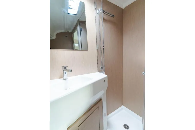  Yacht Photos Pics Modern bathroom interior of 2021 Beneteau Oceanis 40.1 yacht, featuring sink and shower.