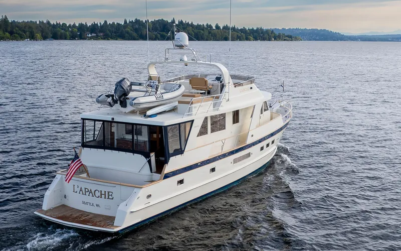 L'apache Yacht Photos Pics Alaskan 65 Flushdeck yacht cruising on a serene lake, 2006 model.