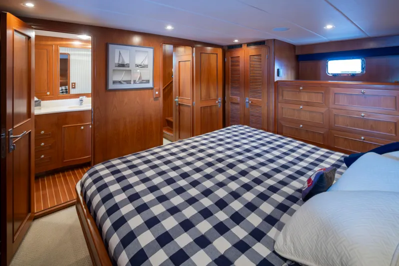 L'apache Yacht Photos Pics Luxurious cabin interior of 2006 Alaskan 65 Flushdeck yacht with checkered bedding.