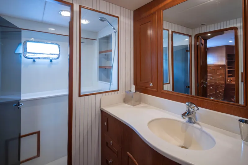 L'apache Yacht Photos Pics Luxurious bathroom in 2006 Alaskan 65 Flushdeck yacht with wood cabinetry and modern fixtures.