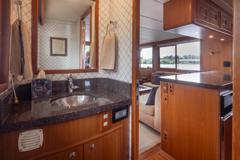L'apache Yacht Photos Pics Luxurious interior of 2006 Alaskan 65 Flushdeck yacht with elegant wood and granite finishes.