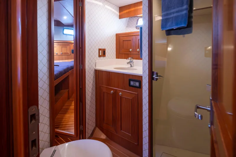 L'apache Yacht Photos Pics Luxurious bathroom interior of 2006 Alaskan 65 Flushdeck yacht with wood accents.