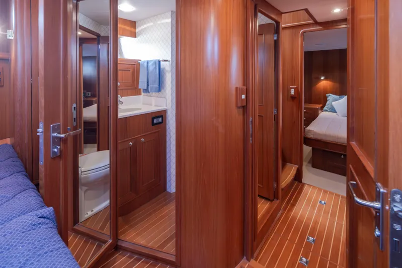 L'apache Yacht Photos Pics Luxurious 2006 Alaskan 65 Flushdeck yacht interior with wood paneling and modern amenities.