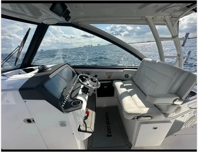  Yacht Photos Pics 2019 Everglades 340 DC boat interior with steering wheel and seating, ocean view.