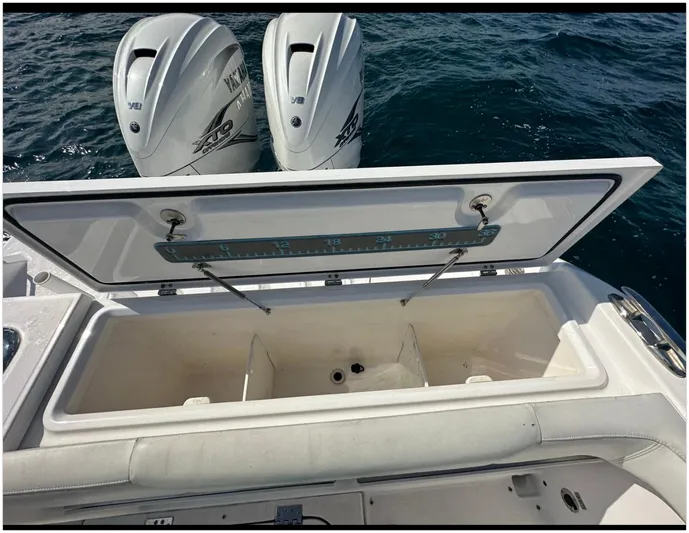  Yacht Photos Pics Open storage compartment on 2019 Everglades 340 DC boat with twin outboard engines.