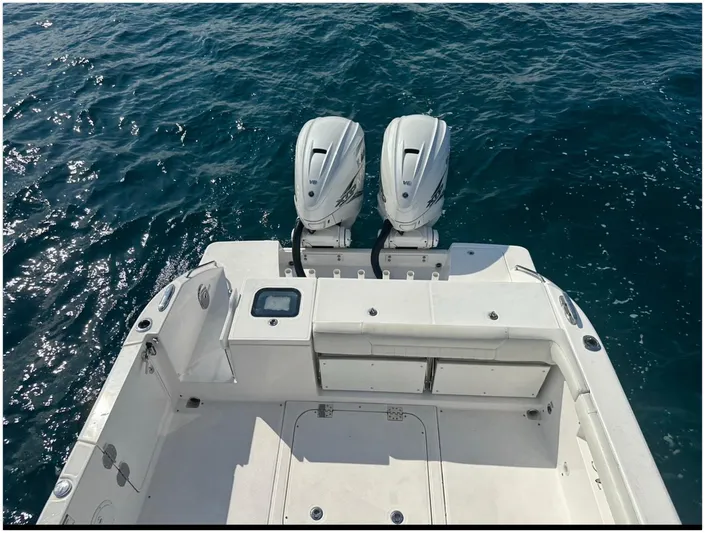  Yacht Photos Pics 2019 Everglades 340 DC boat with dual outboard engines on open water.