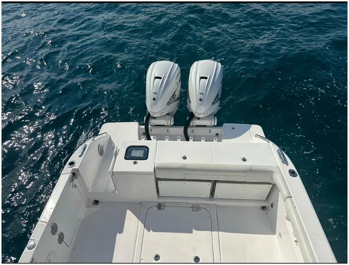  Yacht Photos Pics 2019 Everglades 340 DC boat with dual outboard engines on open water.
