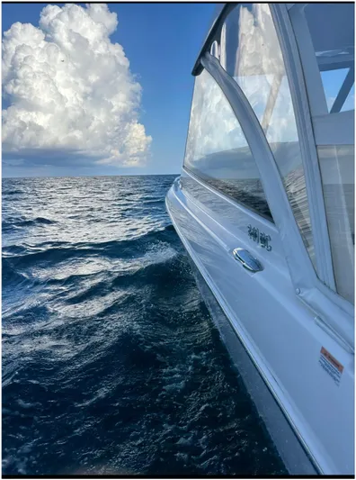  Yacht Photos Pics Everglades 340 DC boat cruising on open ocean under cloudy sky, 2019 model.