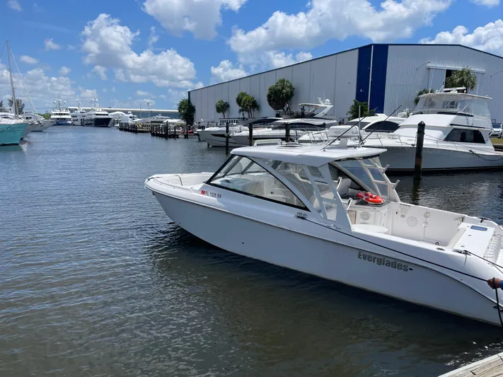  Yacht Photos Pics 2019 Everglades 340 DC boat docked at marina under blue sky.
