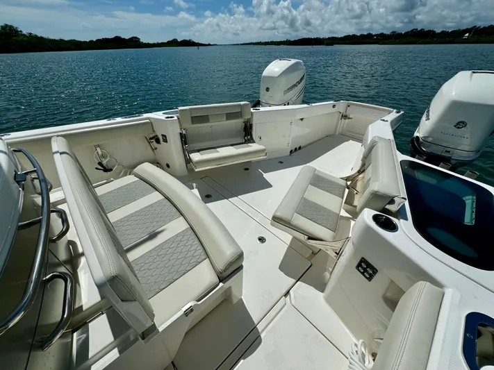 Mermaiden Yacht Photos Pics 2020 Solace 345 boat interior with seating, on a calm lake.