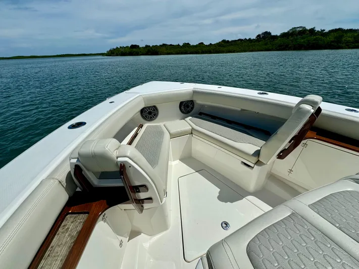 Mermaiden Yacht Photos Pics 2020 Solace 345 boat interior with cushioned seating on calm water.