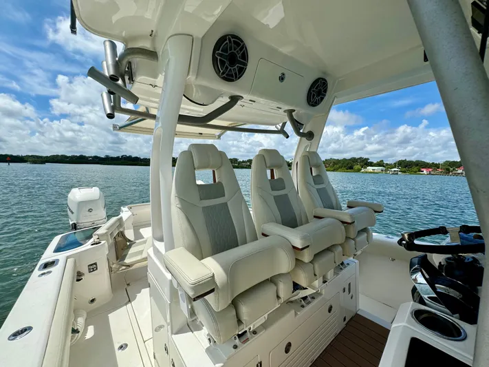 Mermaiden Yacht Photos Pics Luxury seating on 2020 Solace 345 boat, featuring modern design and scenic water view.