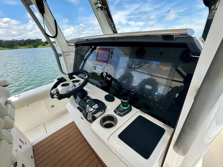 Mermaiden Yacht Photos Pics Solace 345 boat helm with advanced navigation system, 2020 model, on a scenic lake.