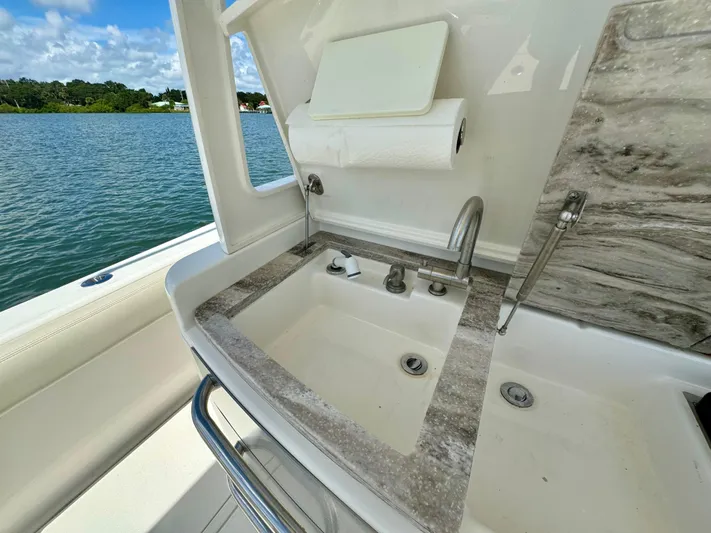 Mermaiden Yacht Photos Pics Luxury boat sink area on Solace 345, 2020 model, with scenic water view.