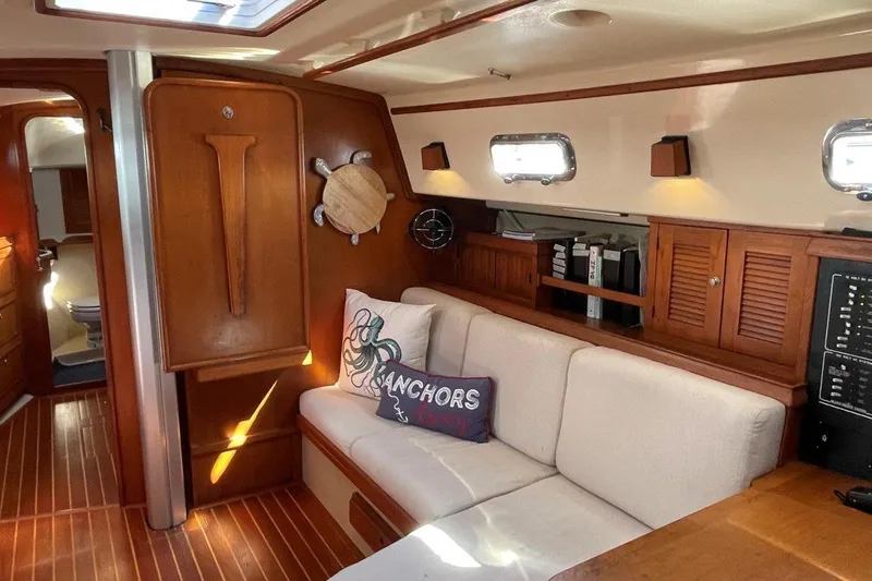 Dream Flower Yacht Photos Pics Interior of 1995 Island Packet 40 yacht with cozy seating and cabinetry.