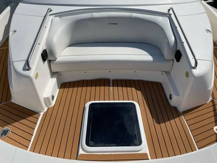  Yacht Photos Pics 2000 Silverton 453 Motor Yacht deck with white seating and teak flooring.