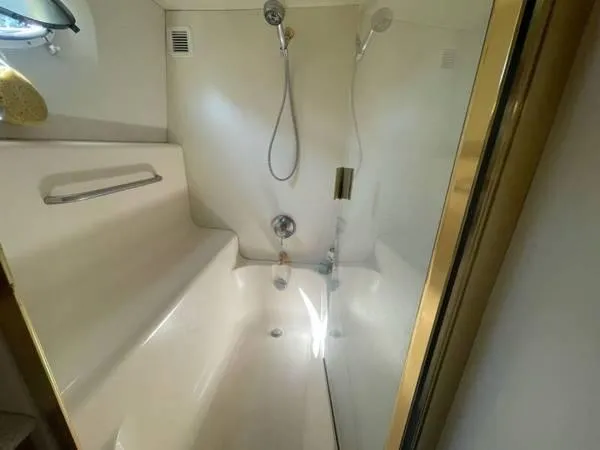  Yacht Photos Pics Luxurious bathroom in 2000 Silverton 453 Motor Yacht with modern shower and sleek design.