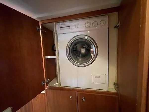  Yacht Photos Pics Washing machine in 2000 Silverton 453 Motor Yacht's wooden cabinet.