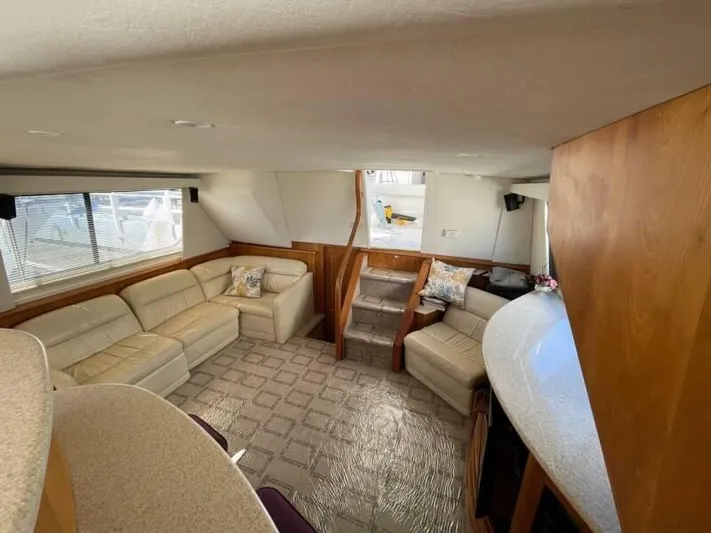  Yacht Photos Pics Interior of 2000 Silverton 453 Motor Yacht with beige leather seating and wooden accents.