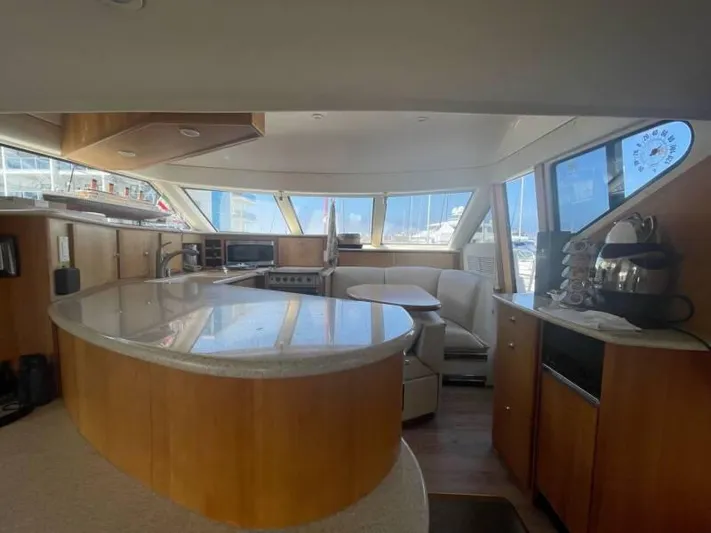  Yacht Photos Pics Interior of 2000 Silverton 453 Motor Yacht with modern kitchen and seating area.