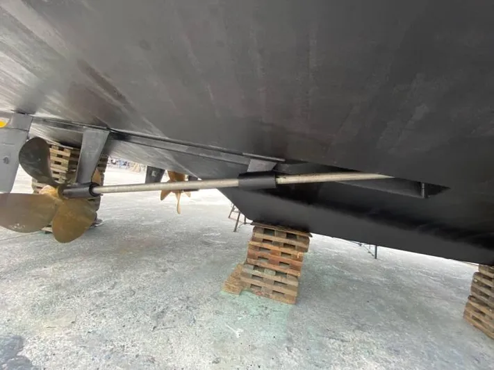  Yacht Photos Pics Underneath view of a 2000 Silverton 453 Motor Yacht on blocks, showing propeller and shaft.