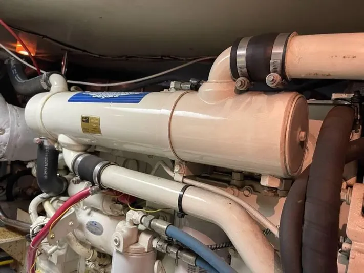  Yacht Photos Pics Engine room of a 2000 Silverton 453 Motor Yacht, showcasing detailed piping and components.