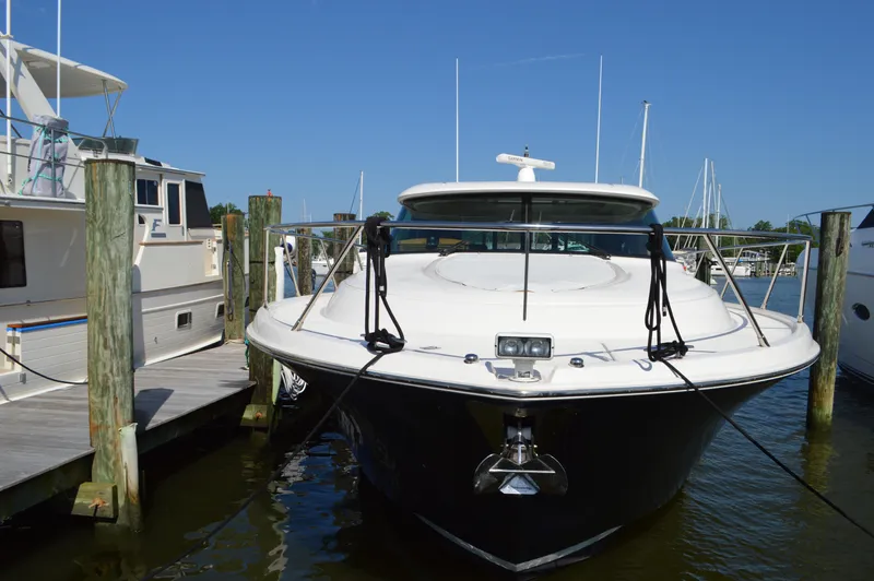 Andros Yacht Photos Pics 2016 Tiara Yachts C44 Coupe docked at marina under clear blue sky.