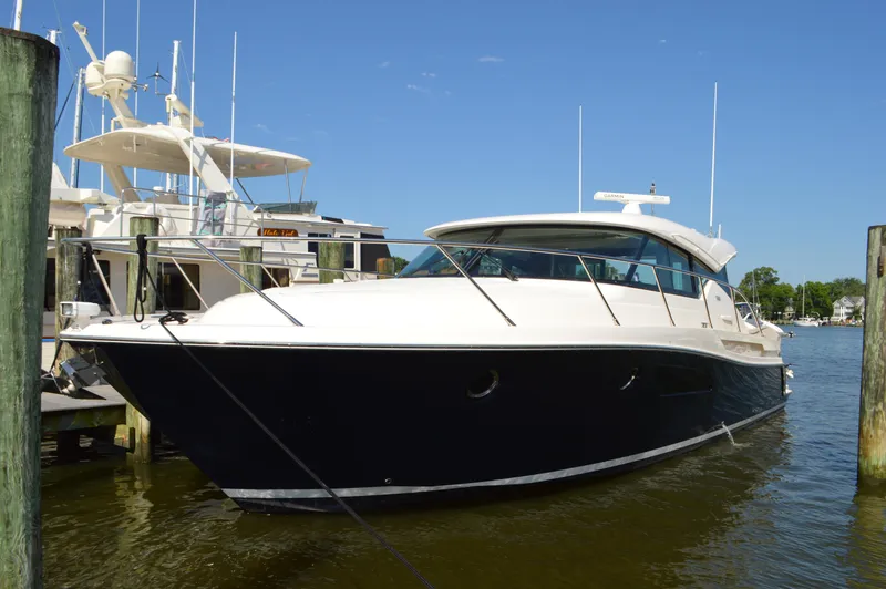 Andros Yacht Photos Pics 2016 Tiara Yachts C44 Coupe docked at marina under clear blue sky.